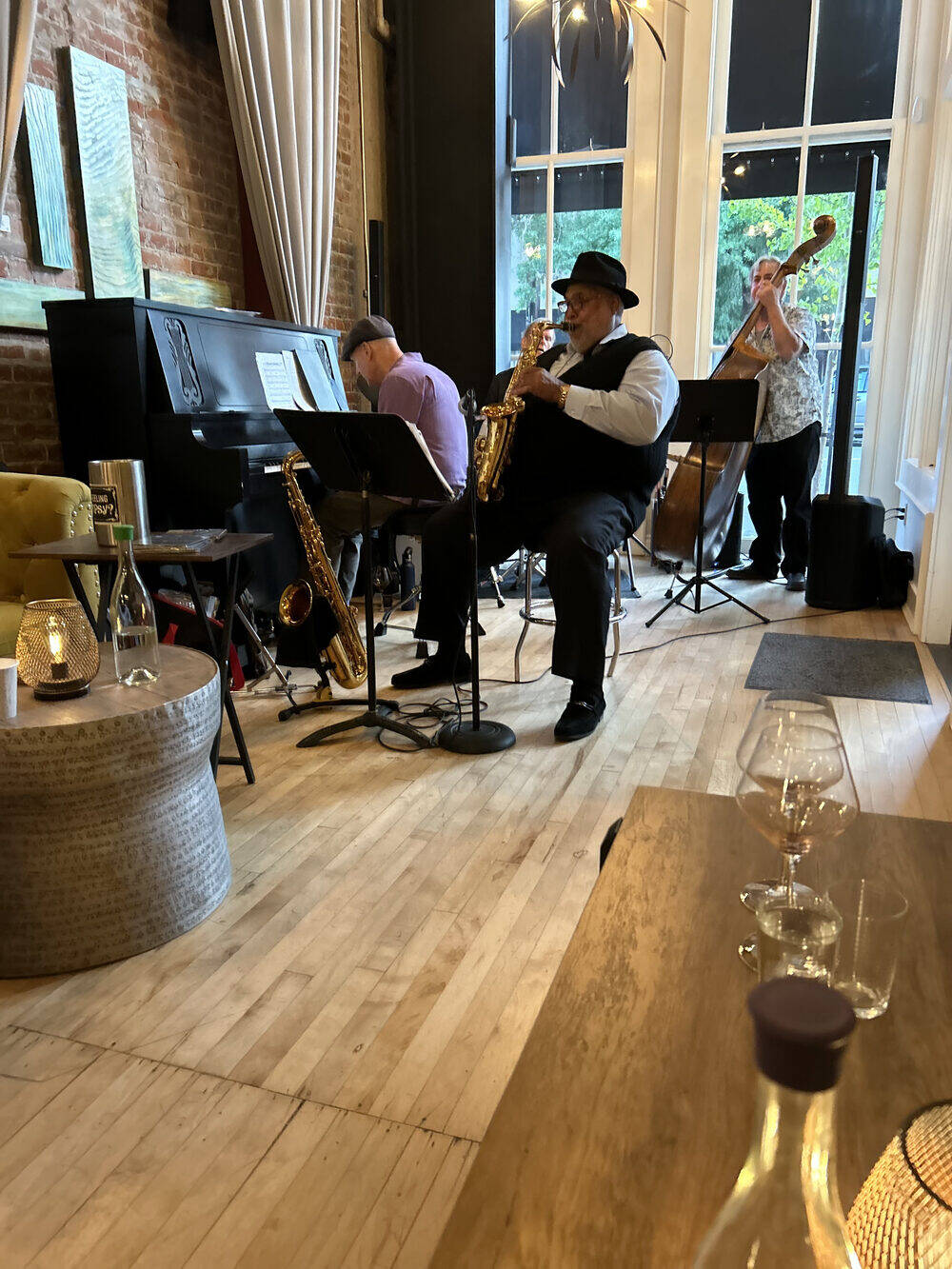 Ron Burris performing saxophone in an upscale lounge