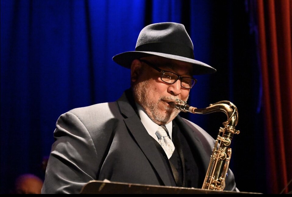 Ron Burris playing tenor saxophone on stage at Yoshi's jazz club
