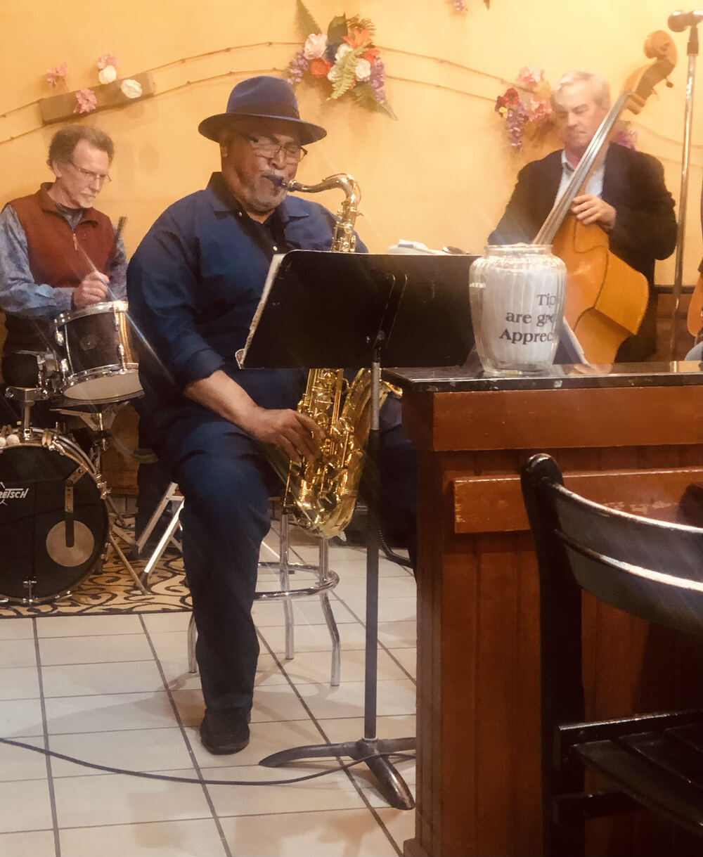 Ron Burris on saxophone with bassist and drummer